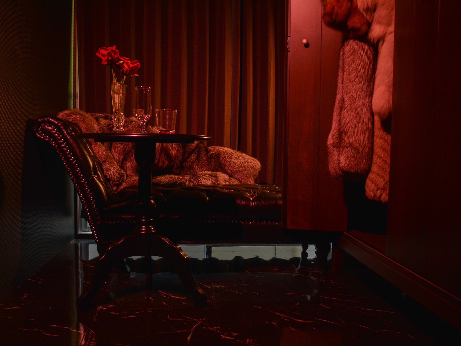 Gothic area — chesterfield sofa and fur display